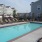 a swimming pool with chairs around it