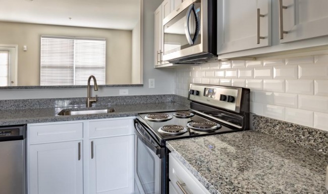 a kitchen with white cabinets