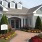 a house with a brick driveway